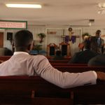 Group of church members sitting in a pew
